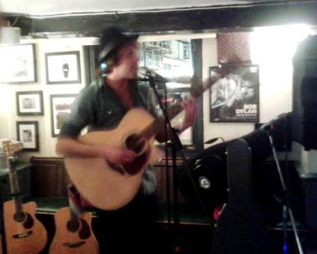 Paul Littler performing at the open mic night